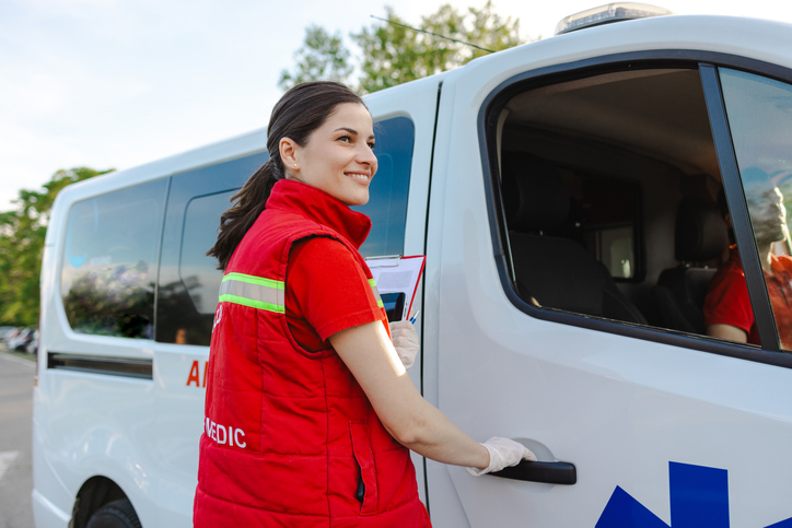 Woman opening medical van door