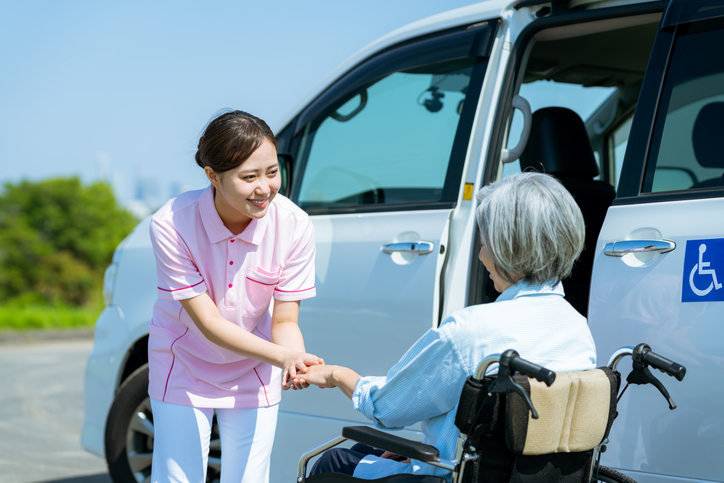 Nurse greeting patient near medical van