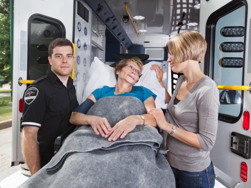 patinet and medical staff oiutside of lifesupport van