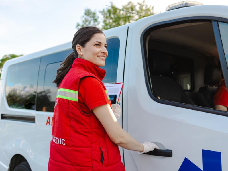 Woman opening medical van door